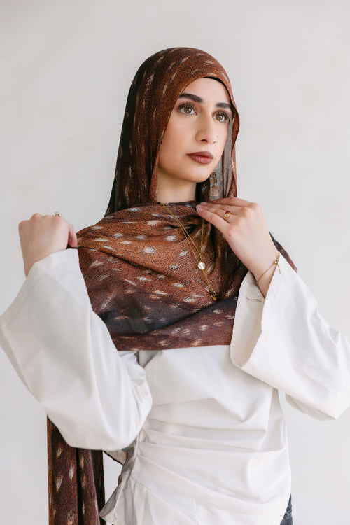 Close-up of the Bambi by Threads by Farah, showcasing stylish design and branding details in a professional photoshoot setting.