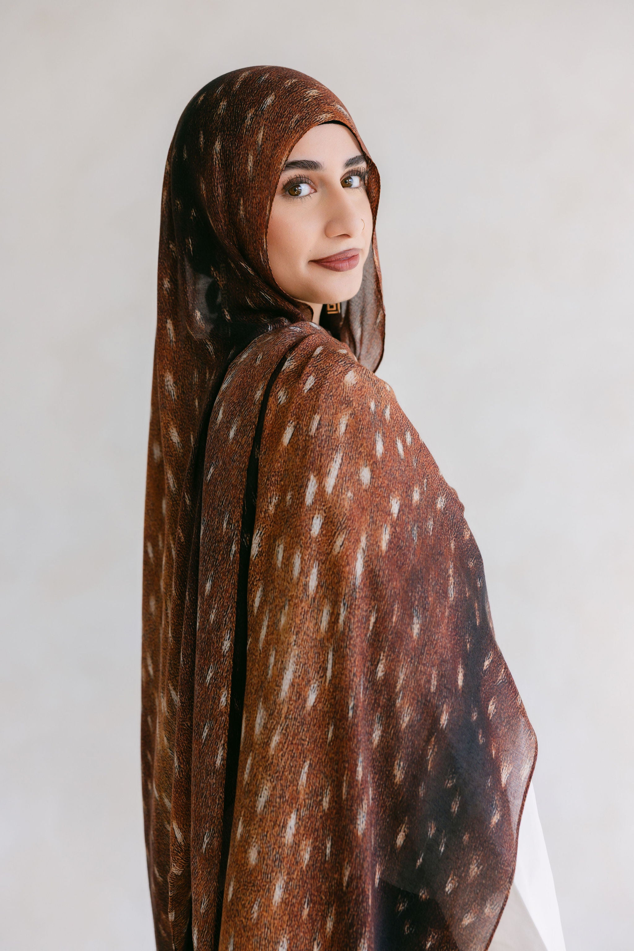 Close-up of the Bambi product from Threads by Farah, showcasing detailed design and branding elements in a professional photoshoot setting.