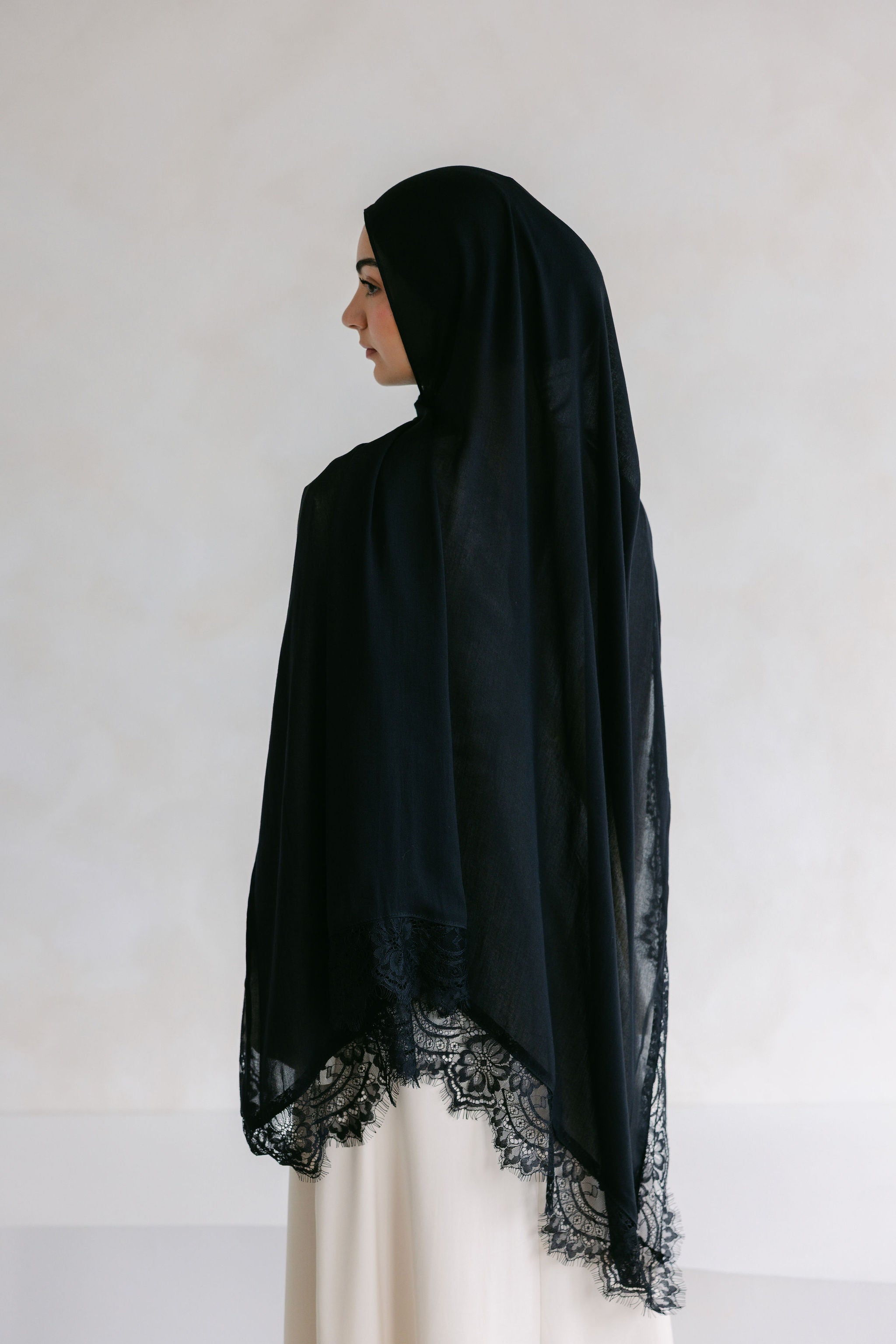 Close-up of the Layla Lace from Threads by Farah, showcasing intricate lace details and elegant design.