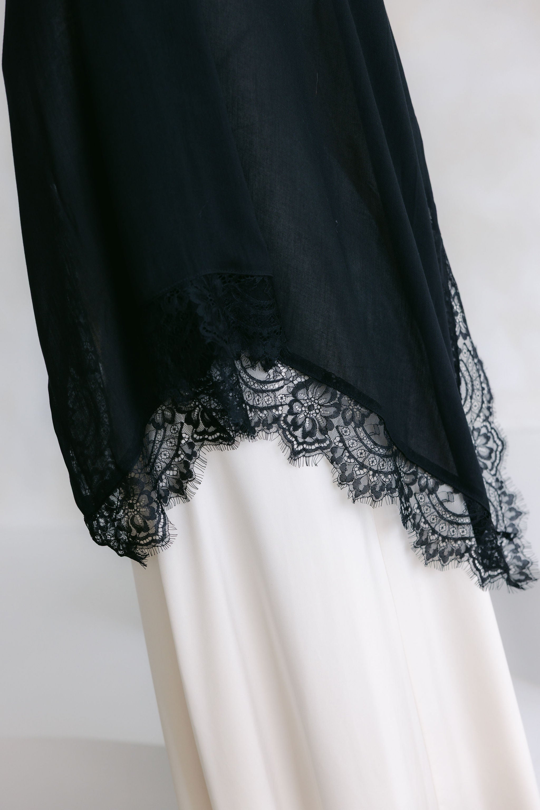 Elegant white lace dress from Threads by Farah's Layla Lace collection, showcased on a model in a professional photoshoot.