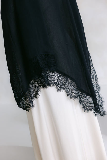 Elegant white lace dress from Threads by Farah's Layla Lace collection, showcased on a model in a professional photoshoot.