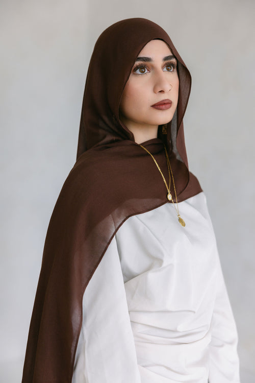 Chocolate brown Threads by Farah clothing item displayed on a model during a photoshoot, highlighting the fabric and fit.