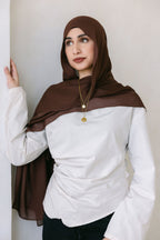 Chocolate brown Threads by Farah clothing item displayed in a professional branding photoshoot, styled with natural lighting.