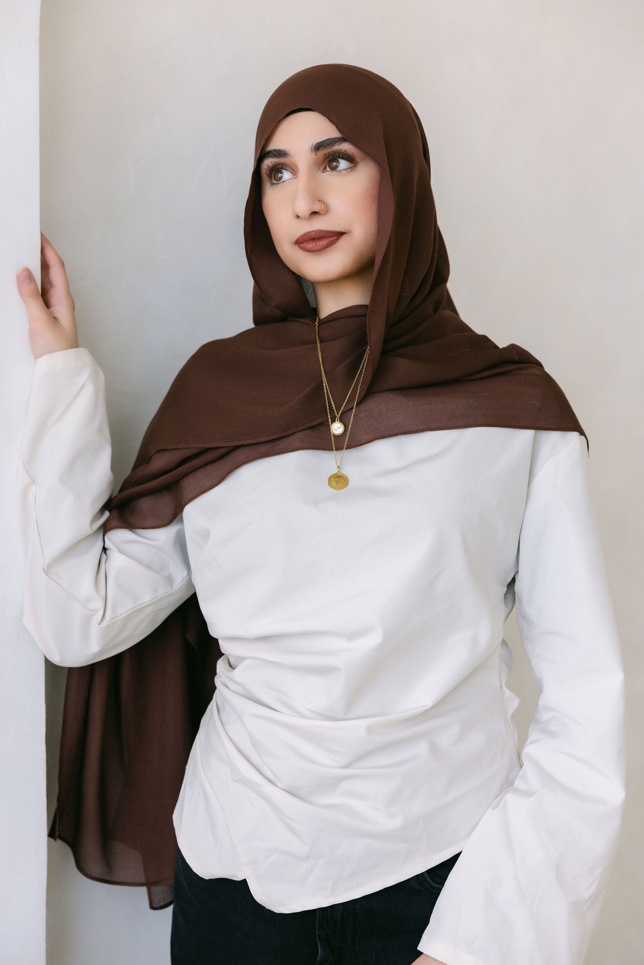Chocolate brown Threads by Farah clothing item displayed in a professional branding photoshoot, styled with natural lighting.