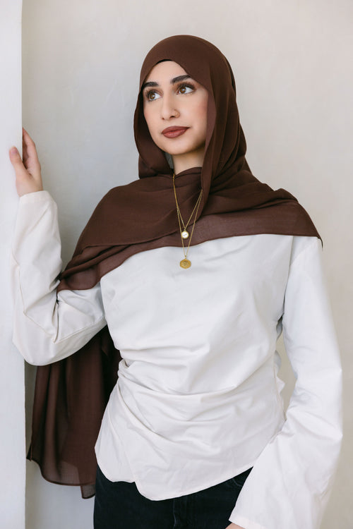 Chocolate brown Threads by Farah clothing item displayed in a professional branding photoshoot, styled with natural lighting.