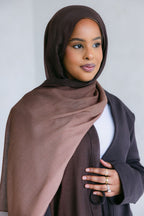 Ombre latte from Threads by Farah, featuring a beautifully blended coffee drink with layered ombre colors in a clear glass.