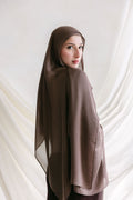 Deep taupe fabric swatch from Threads by Farah, shown in a professional branding photoshoot setting.