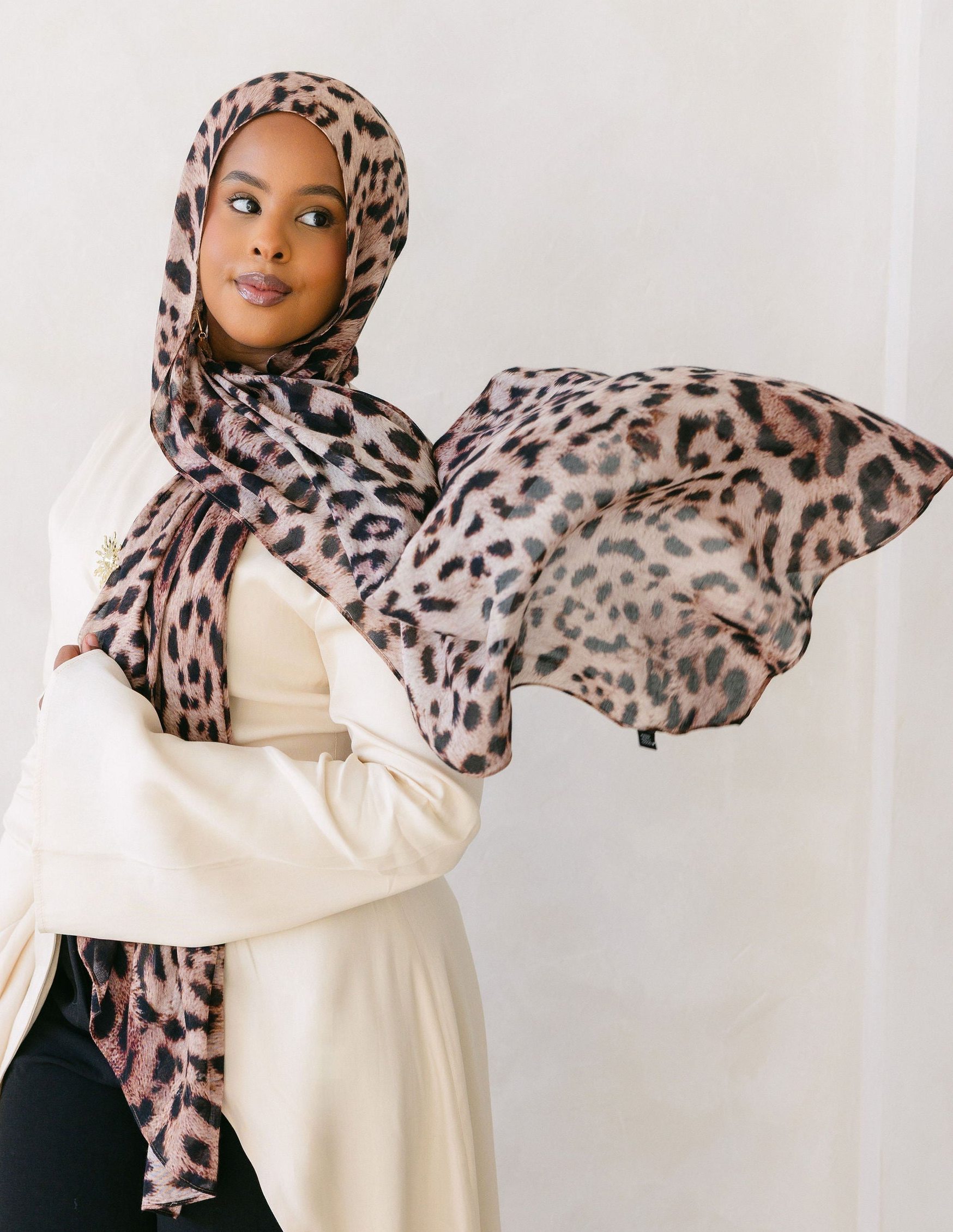 Cheetah print fabric from Threads by Farah, showcasing a stylish and vibrant animal print pattern on a clothing item.