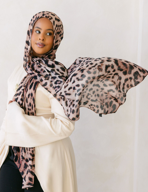 Cheetah print fabric from Threads by Farah, showcasing a stylish and vibrant animal print pattern on a clothing item.