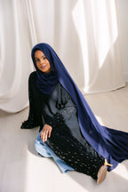 Navy blue fabric swatch from Threads by Farah, displayed on a plain background in a professional photoshoot setting.