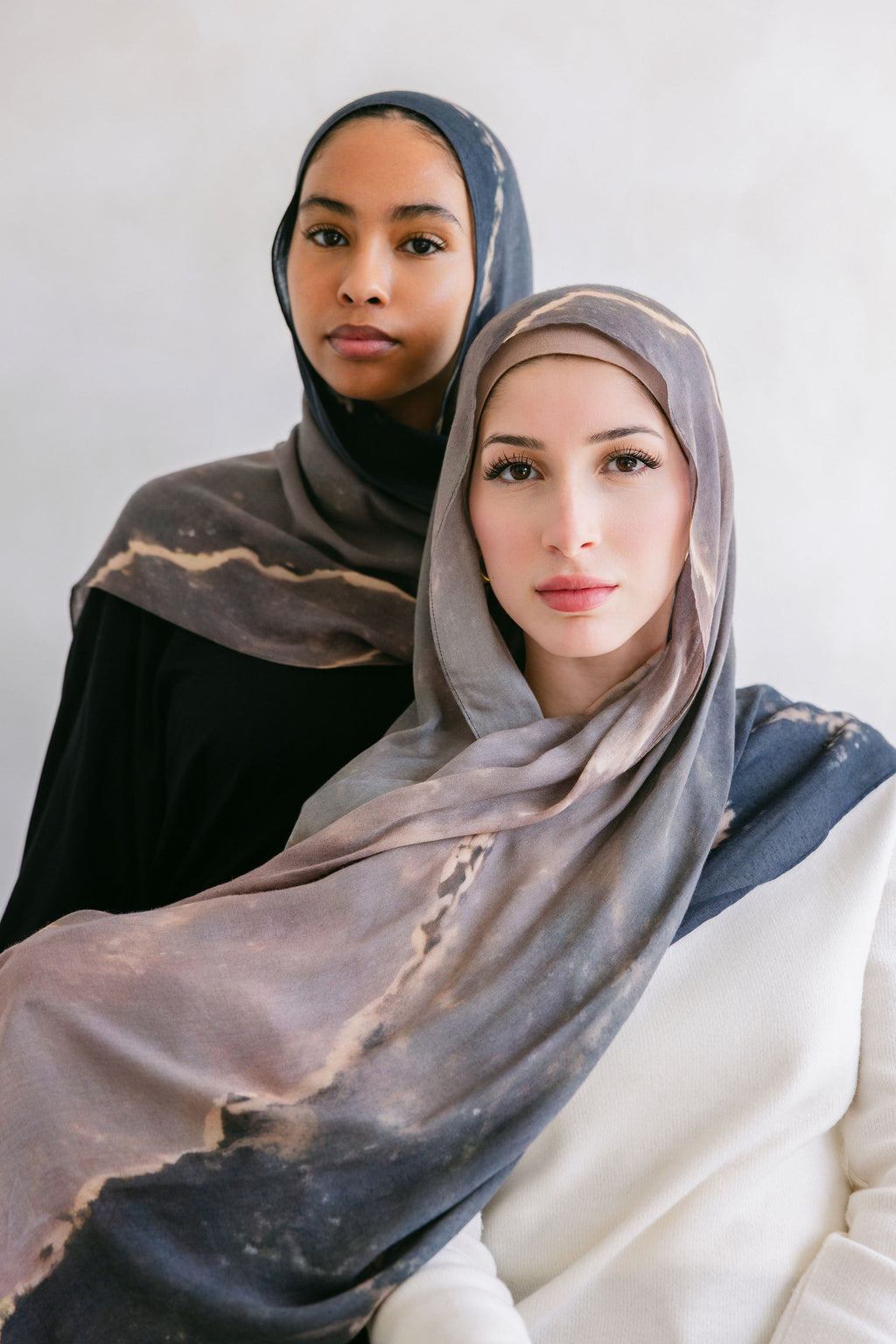 Close-up of a marble stone showcasing its white and gray veined pattern, from Threads by Farah's branding photoshoot.