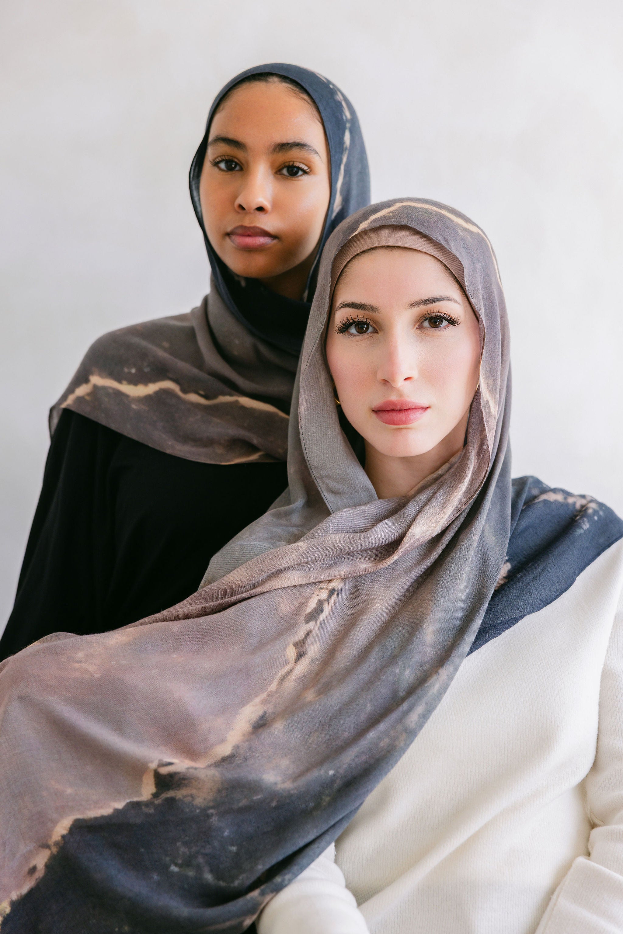 Close-up of a marble stone showcasing its white and gray veined pattern, from Threads by Farah's branding photoshoot.