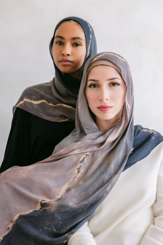 Close-up of a marble stone showcasing its white and gray veined pattern, from Threads by Farah's branding photoshoot.