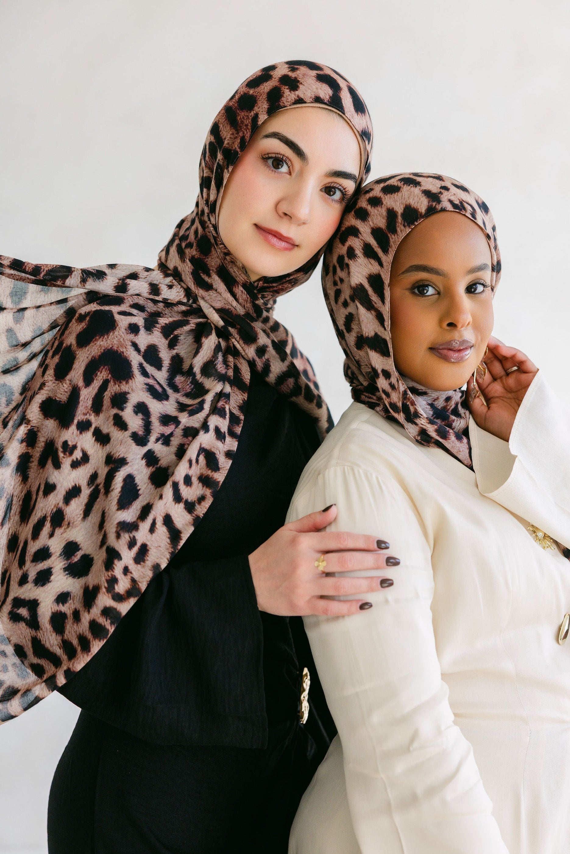 Close-up of a cheetah with spotted fur, showcasing natural patterns on a Threads by Farah product.